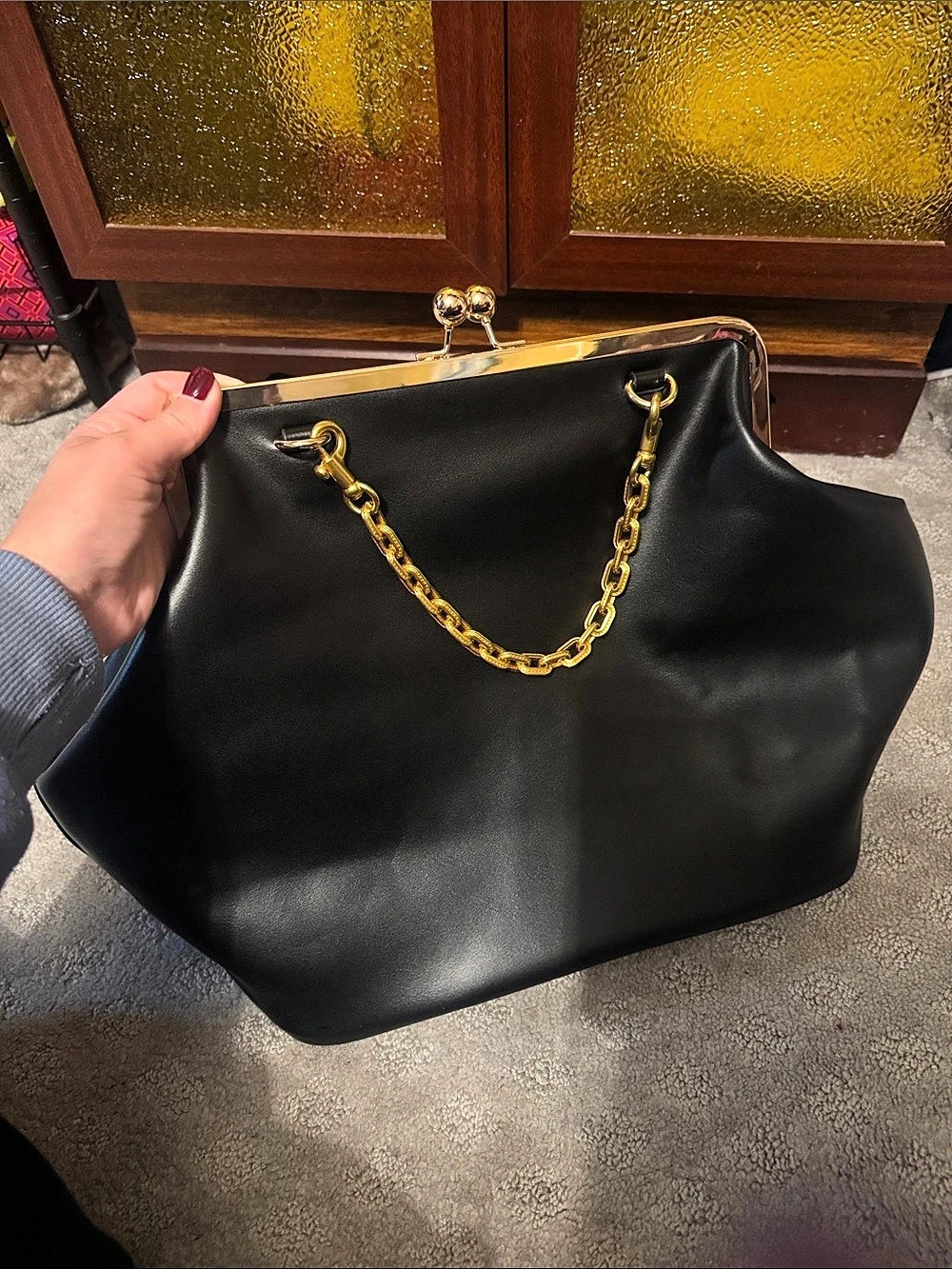 Black oversized kisslock bag